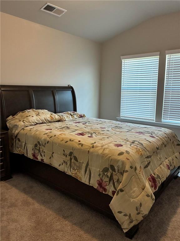 161 Donovan Avenue Locust Grove, GA 30248 - Photo 39 of 42 a bed sitting in a bedroom next to a window