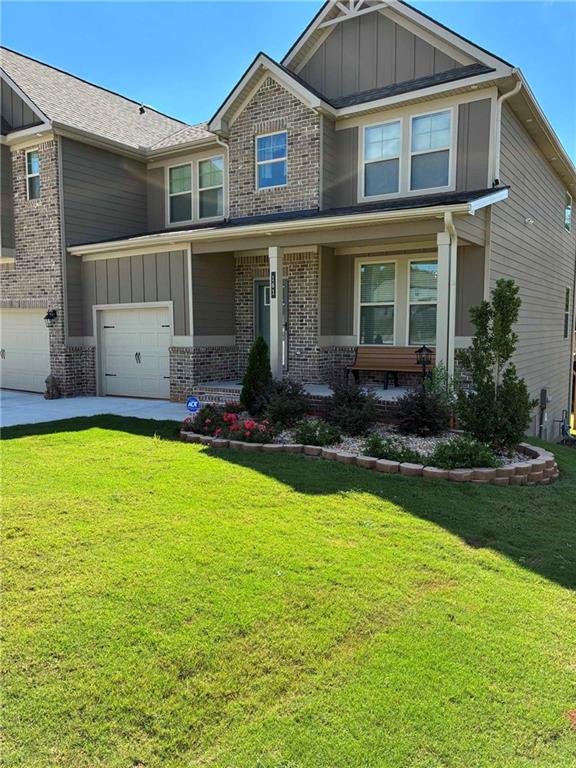 161 Donovan Avenue Locust Grove, GA 30248 - Photo 4 of 42 a front view of a house with swimming pool