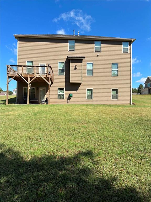 161 Donovan Avenue Locust Grove, GA 30248 - Photo 7 of 42 a view of a big yard with an outdoor seating