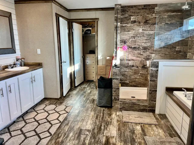 a room with washing machine and cabinets