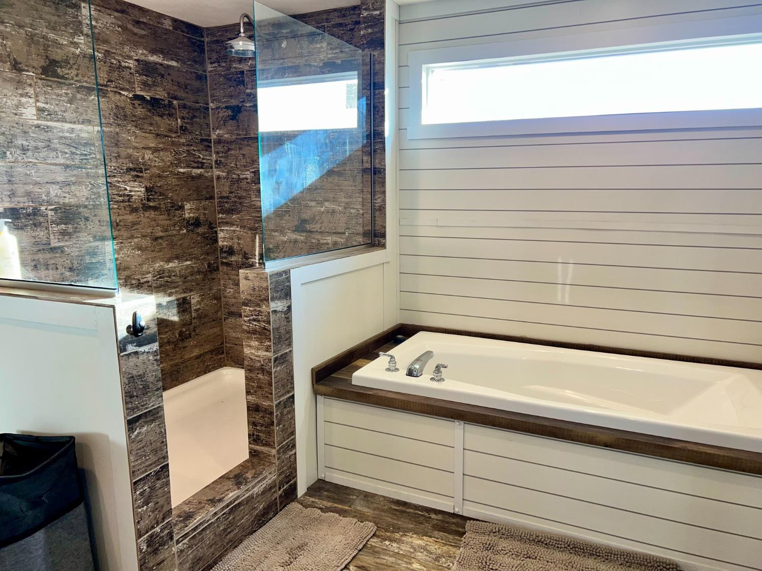 1021 Avenue North Ralls, TX 79357 - Photo 17 of 29 a bathroom with a bathtub and a window