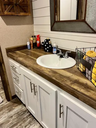 a kitchen with a sink and cabinets