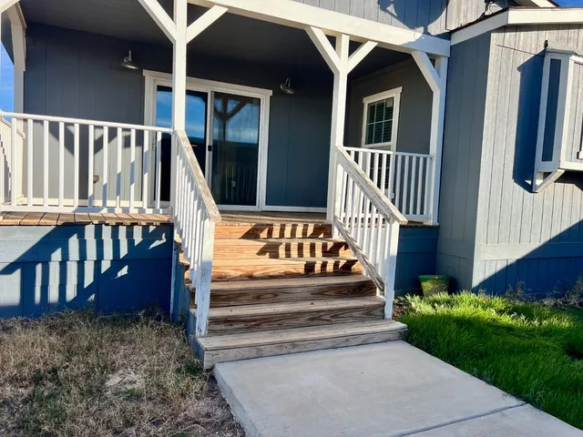 a front view of a house with yard