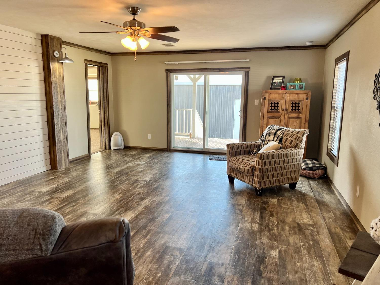 1021 Avenue North Ralls, TX 79357 - Photo 5 of 29 a living room with furniture and wooden floor