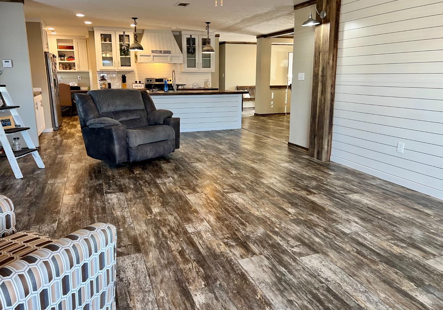 1021 Avenue North Ralls, TX 79357 - Photo 8 of 29 a living room with furniture and a wooden floor
