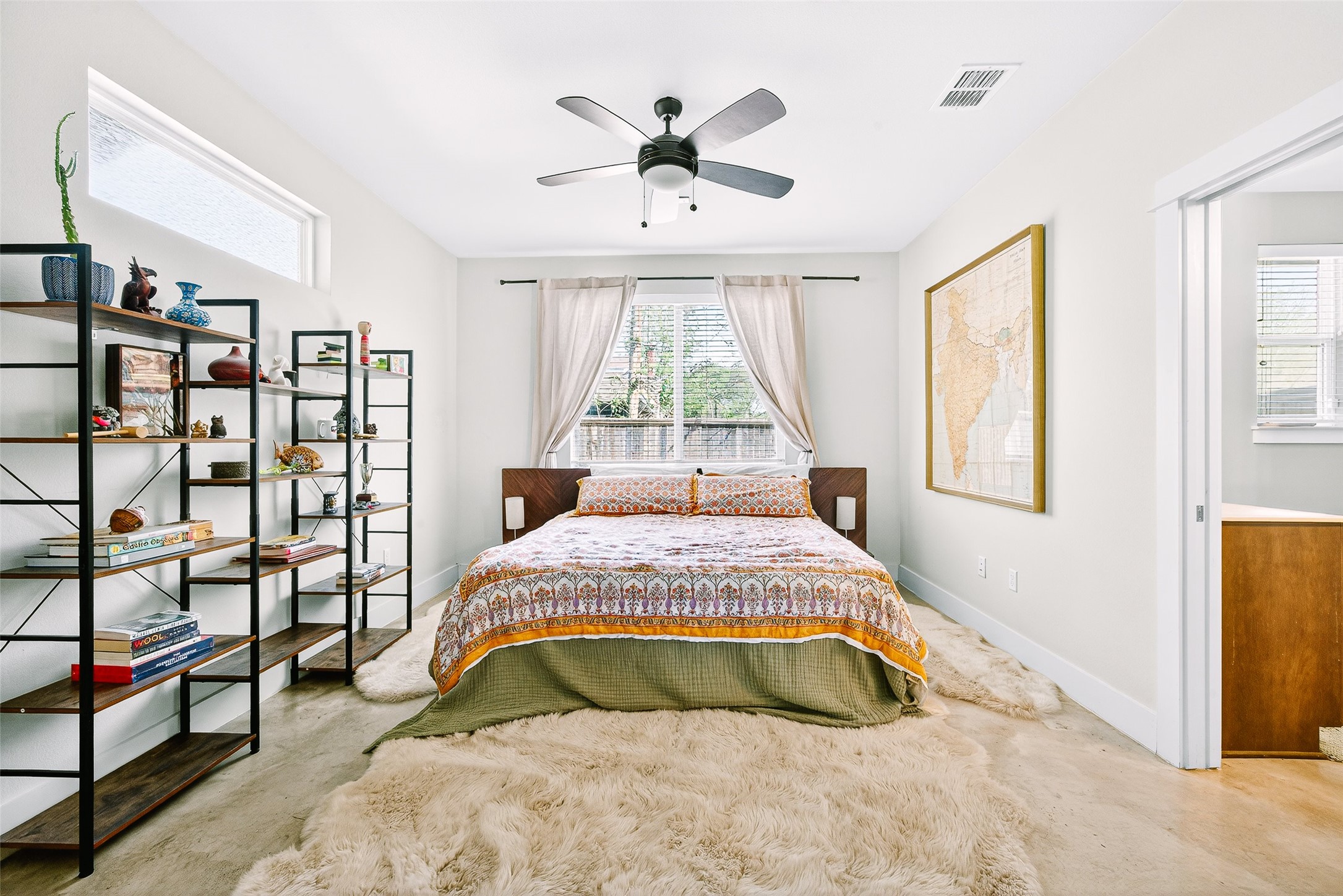 4917 Sunset Trail, Unit A Austin, TX 78745 - Photo 17 of 36 Bedroom with a ceiling fan and light colored carpet