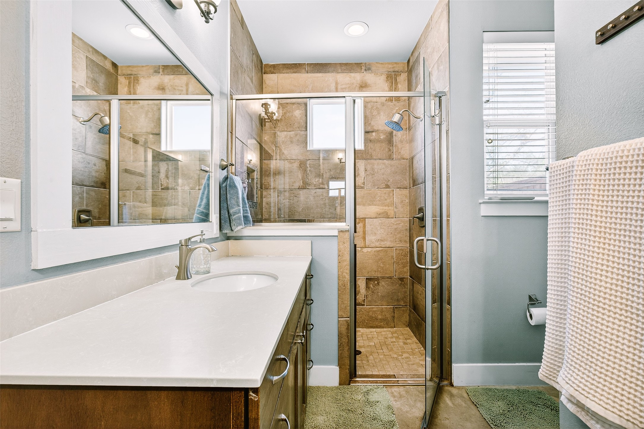 4917 Sunset Trail, Unit A Austin, TX 78745 - Photo 21 of 36 Full bathroom featuring vanity and a shower stall