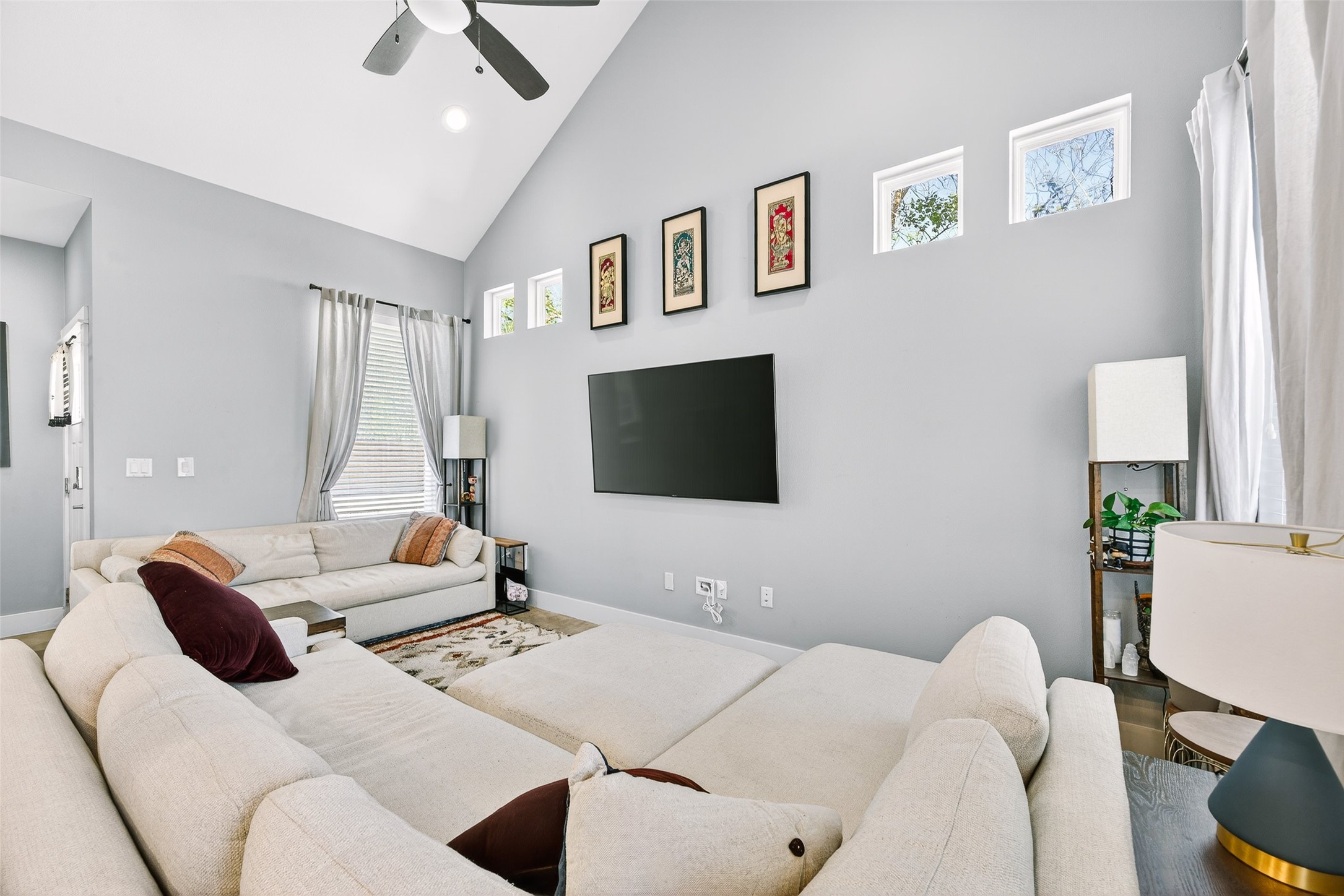 4917 Sunset Trail, Unit A Austin, TX 78745 - Photo 3 of 36 Living area with ceiling fan, vaulted ceiling, plenty of natural light, and recessed lighting