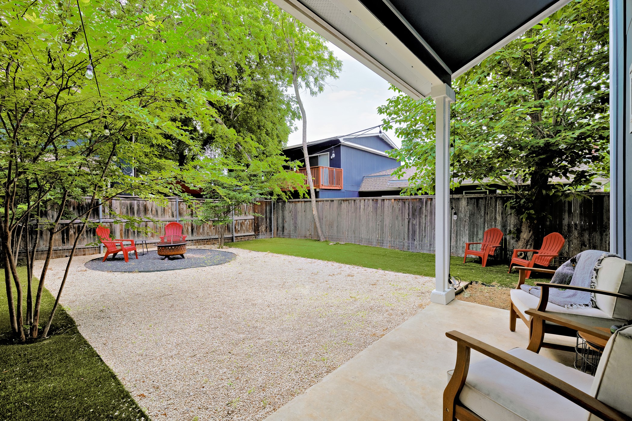 4917 Sunset Trail, Unit A Austin, TX 78745 - Photo 30 of 36 Fenced backyard with a patio area and a fire pit