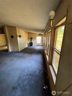 a view of empty room with windows