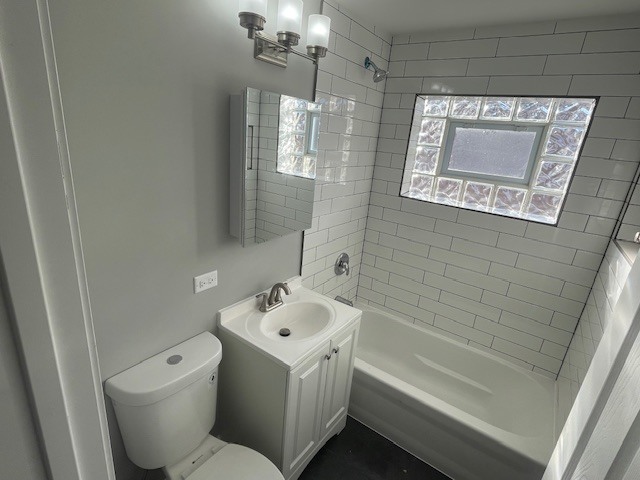 432 West Hickory Street, Unit 1 Chicago Heights, IL 60411 - Photo 11 of 11 a bathroom with a sink a toilet and shower
