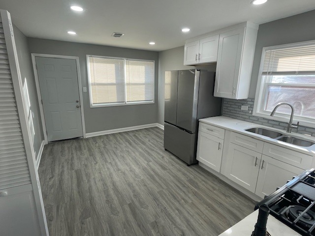 432 West Hickory Street, Unit 1 Chicago Heights, IL 60411 - Photo 6 of 11 a kitchen with a refrigerator a sink and cabinets