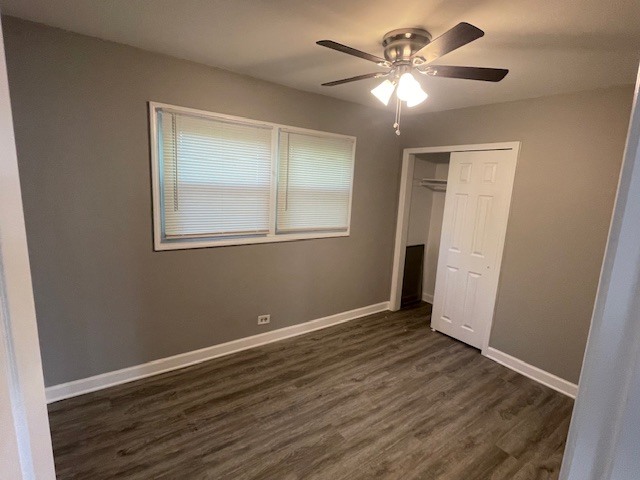 432 West Hickory Street, Unit 1 Chicago Heights, IL 60411 - Photo 8 of 11 an empty room with wooden floor and a ceiling fan
