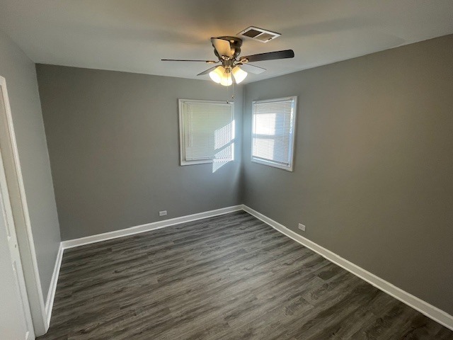 432 West Hickory Street, Unit 1 Chicago Heights, IL 60411 - Photo 10 of 11 a view of wooden floor and chandelier fan in a room
