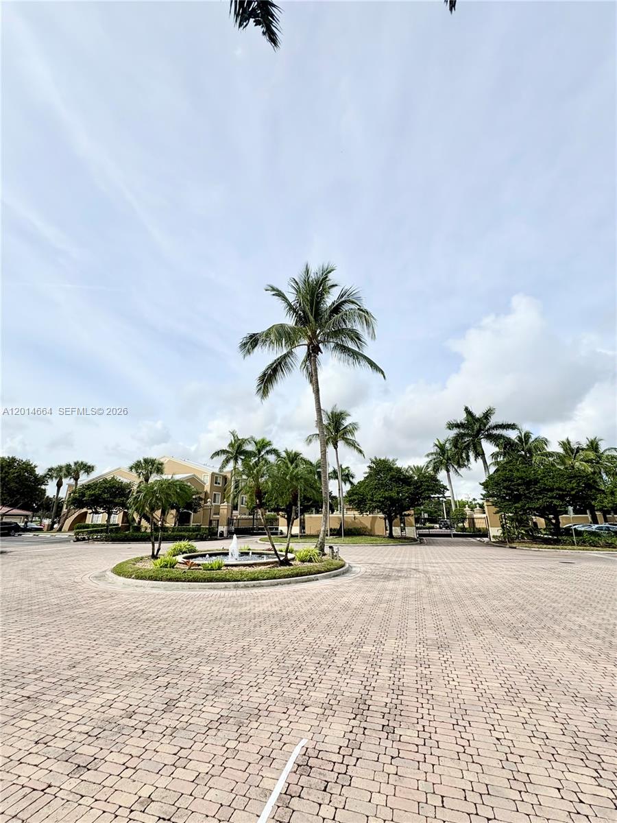 8030 North Nob Hill Road, Unit 105 Tamarac, FL 33321 - Photo 1 of 22 a view of road with houses