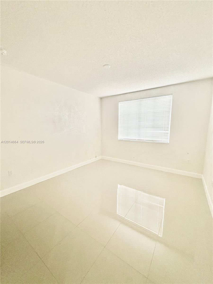 8030 North Nob Hill Road, Unit 105 Tamarac, FL 33321 - Photo 11 of 22 a view of a bathtub in a room