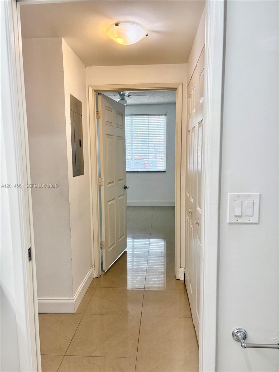 8030 North Nob Hill Road, Unit 105 Tamarac, FL 33321 - Photo 12 of 22 a bathroom with a sink and a mirror