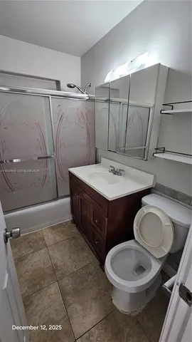 a view of a livingroom with wooden floor and window