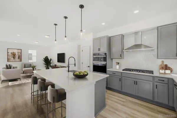 a kitchen with sink cabinets and living room view