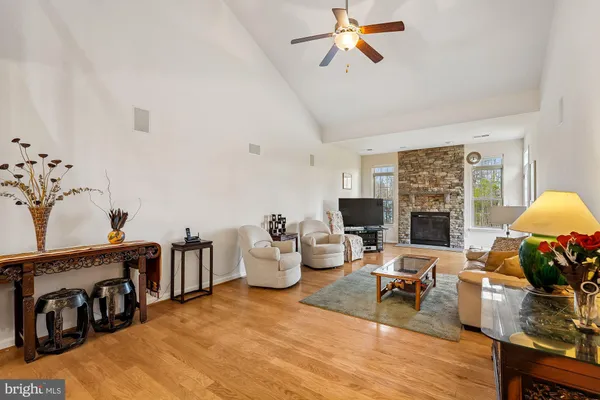 a view of a dining room with furniture wooden floor and a chandelier