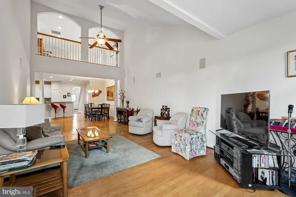 a view of a dining room with furniture and a chandelier