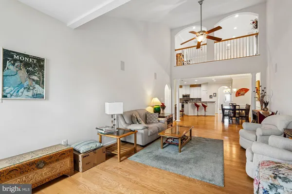 a kitchen with granite countertop a sink a stove refrigerator and microwave