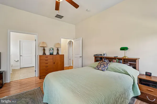 a view of staircase with railing and chandelier