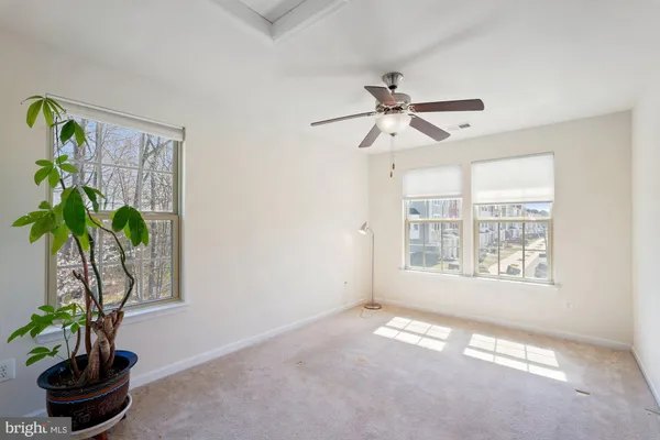 a view of a livingroom with furniture and windows