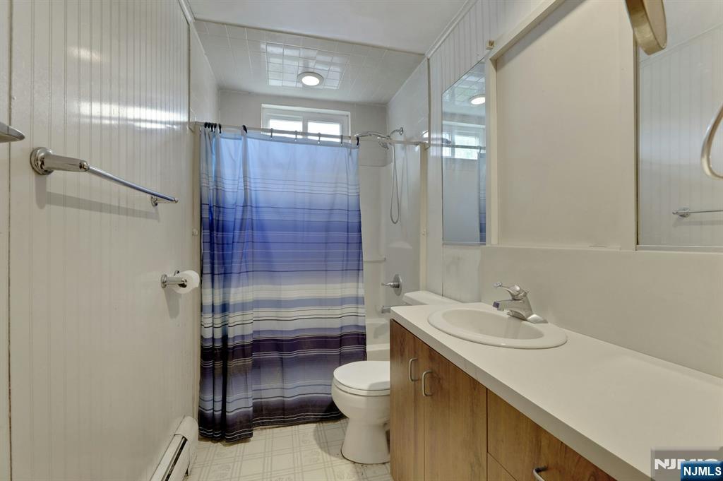 17 Butler Place Wanaque, NJ 07420 - Photo 17 of 28 a bathroom with a sink toilet and shower