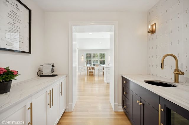 a kitchen with a sink and a refrigerator