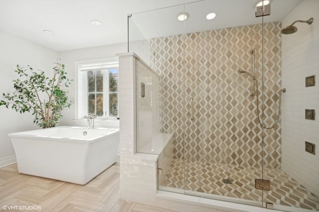 a bathroom with a sink a mirror and a bathtub