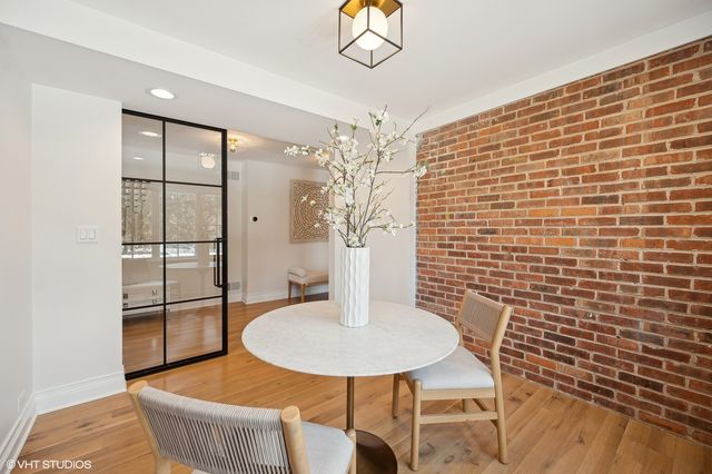 a dining room with table and chairs