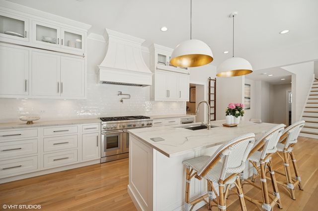 a kitchen with a table and chairs in it