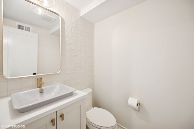 a bathroom with a sink a mirror and shower