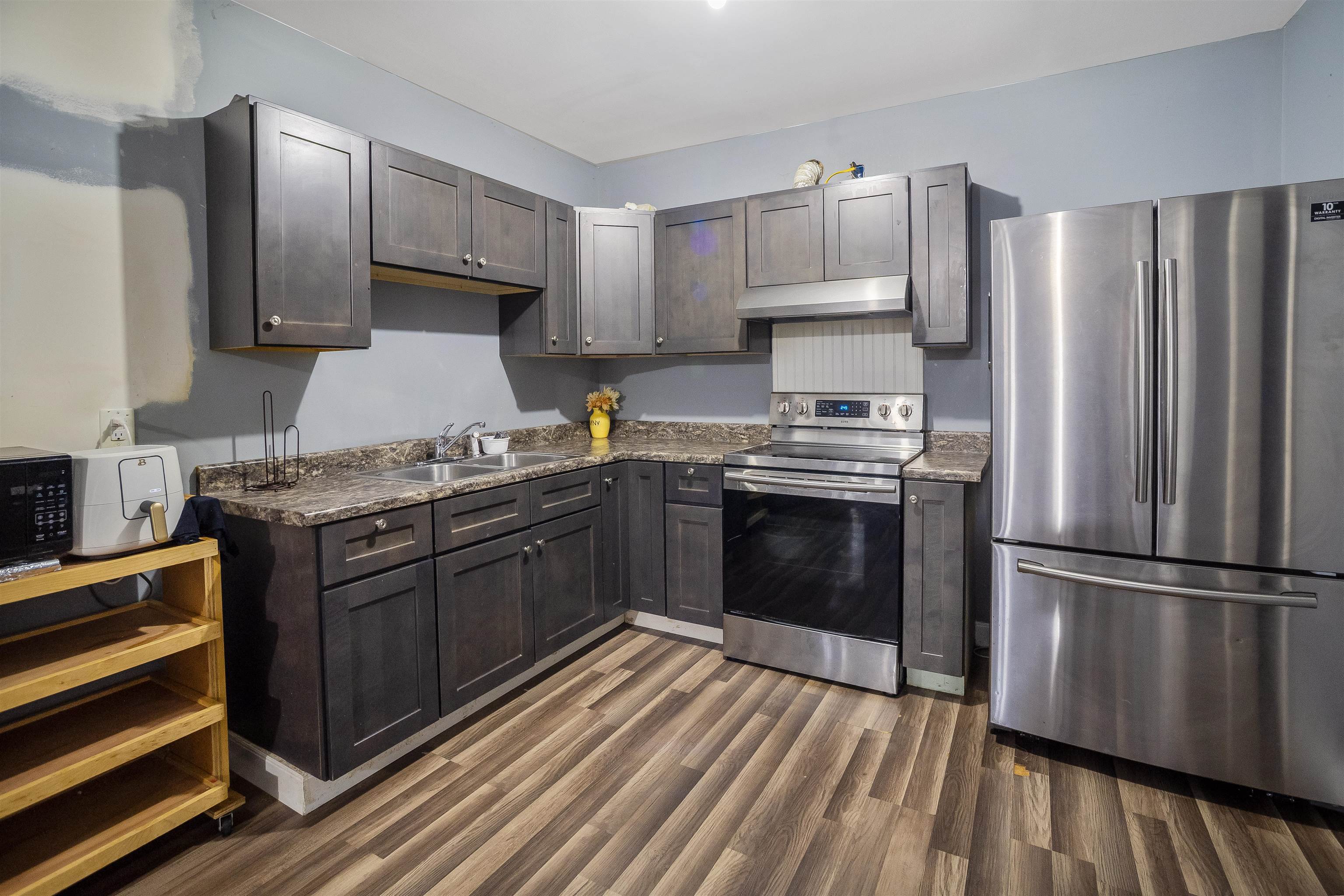 1771 Marble Ridge Drive Harrisonburg, VA 22801 - Photo 23 of 49 a kitchen with granite countertop stainless steel appliances and wooden cabinets