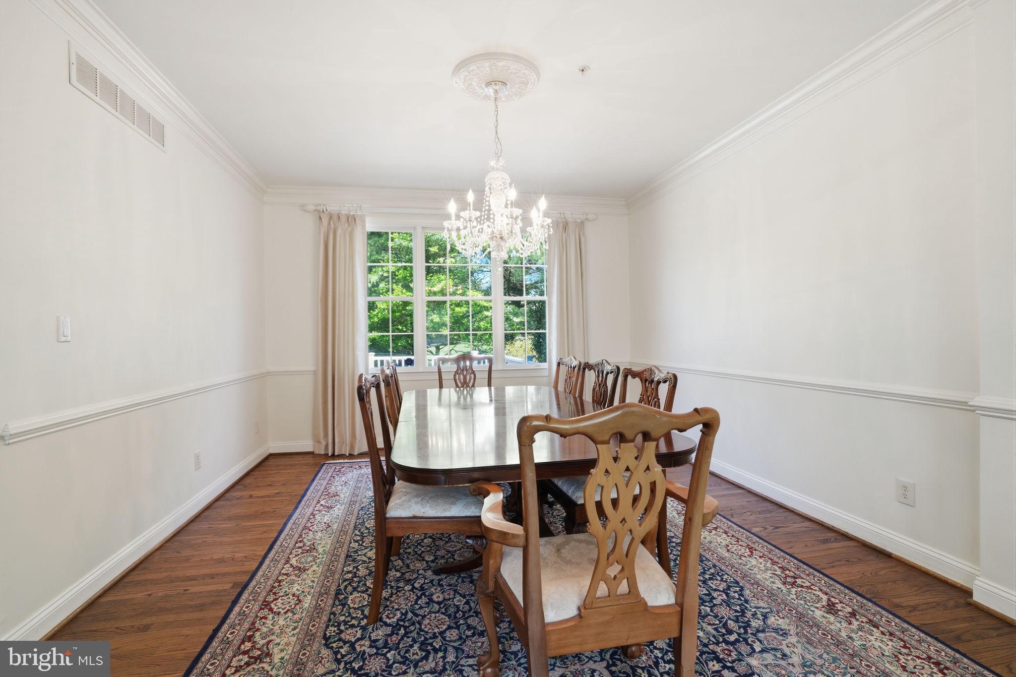53 Alexanders Court Newtown, PA 18940 - Photo 8 of 61 a dining room with furniture a chandelier and wooden floor