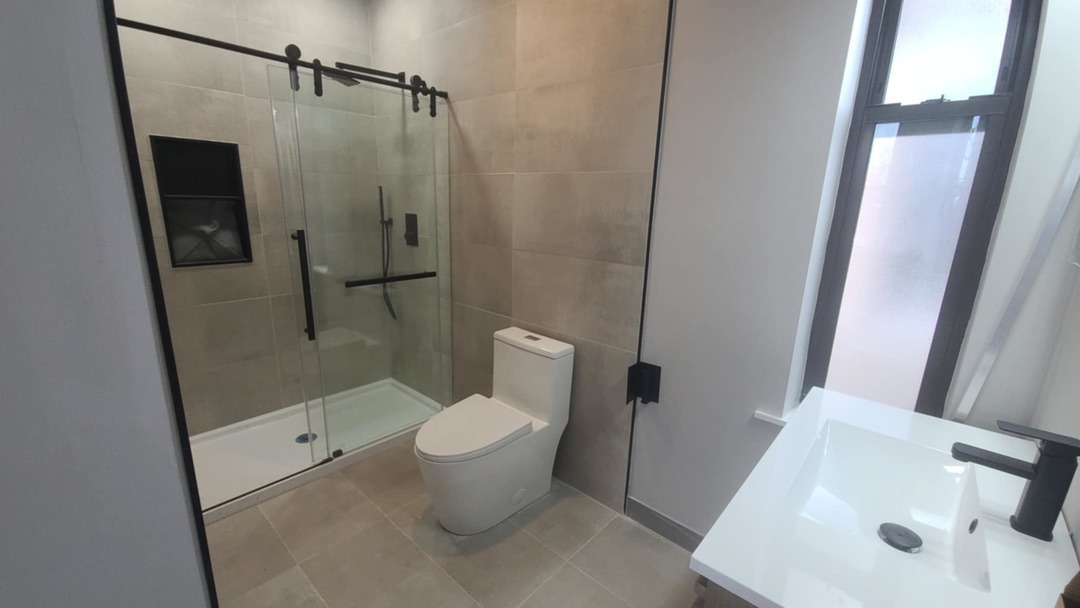 6443 South Peoria Street, Unit 1 Chicago, IL 60621 - Photo 8 of 13 a bathroom with a sink toilet and shower