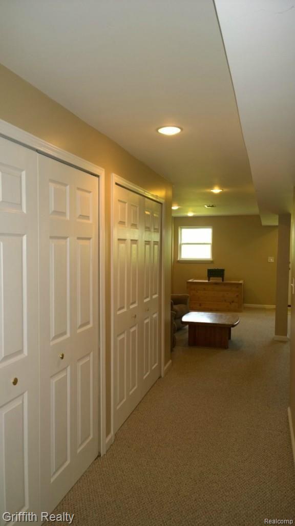 736 Fowlerville Road Fowlerville, MI 48836 - Photo 43 of 84 You guessed it, Much more ideal storage in LL. Down the hall is the family room at the walkout end of the basement