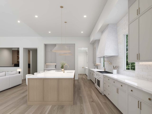 a large white kitchen with a large window