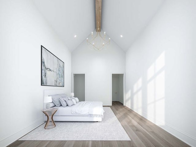 an aerial view of residential houses with outdoor space and trees