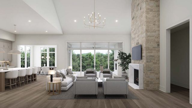 a living room with fireplace furniture and a large window