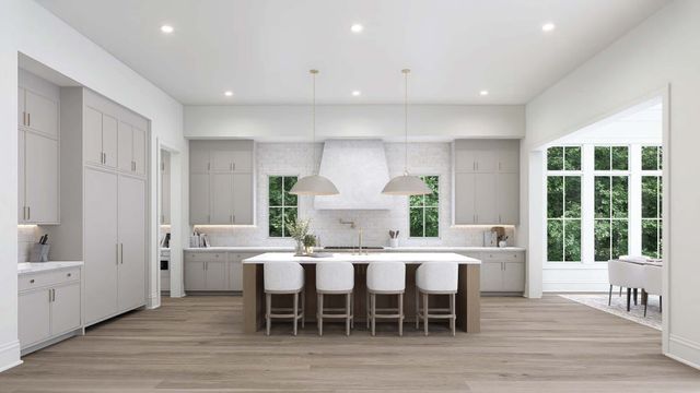 a large kitchen with a table and chairs