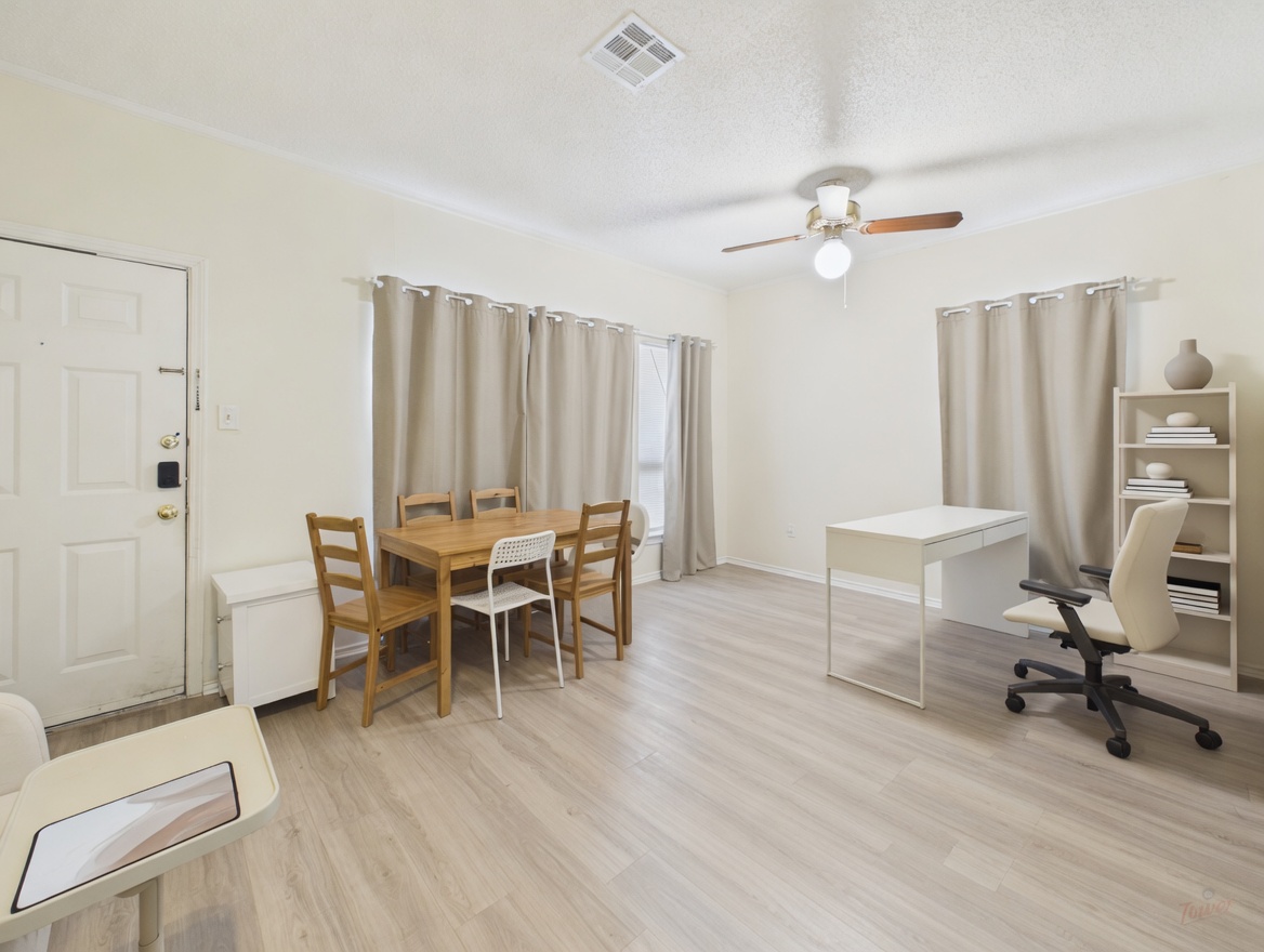 2804 Rio Grande Street, Unit 201 Austin, TX 78705 - Photo 3 of 10 a view of a workspace with furniture and a window