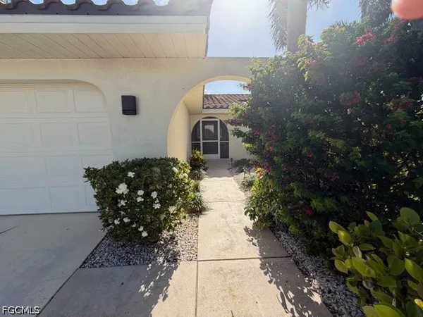 a front view of a house with garden