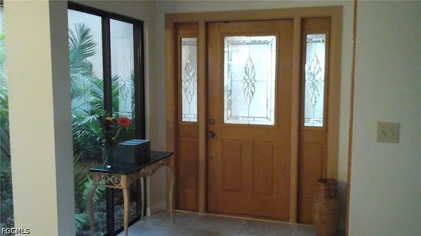 a potted plant in front of a door