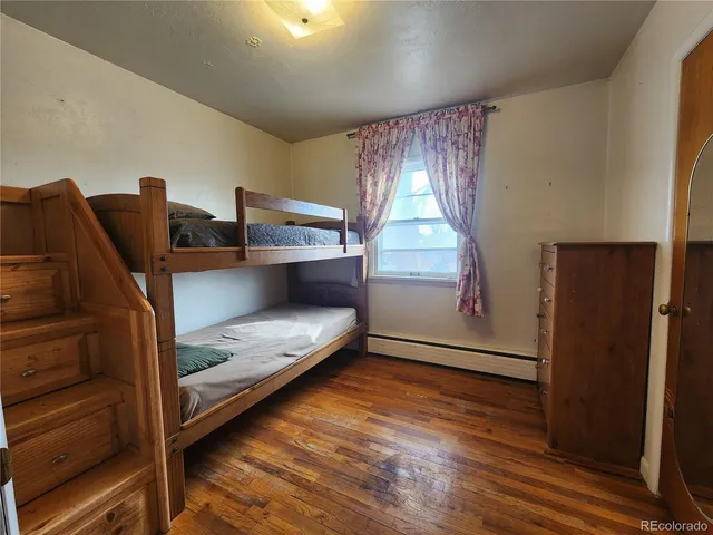 a view of kitchen with furniture and wooden floor