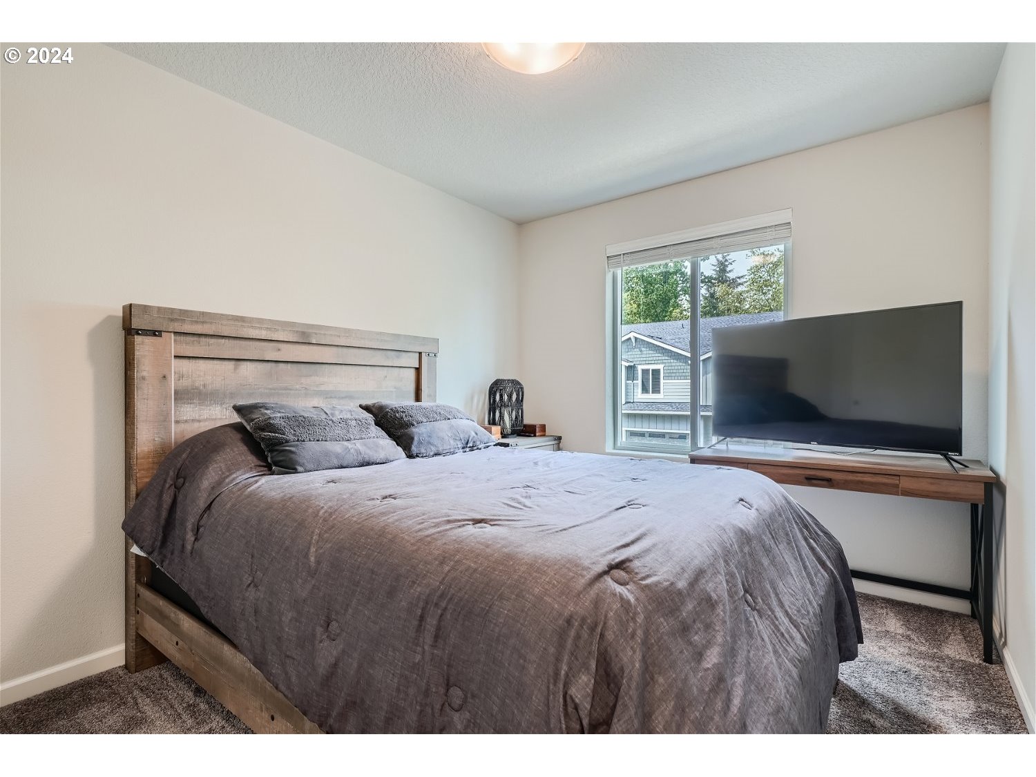 2348 South Trail View Ridgefield, WA 98642 - Photo 23 of 28 a bedroom with a bed and a flat screen tv