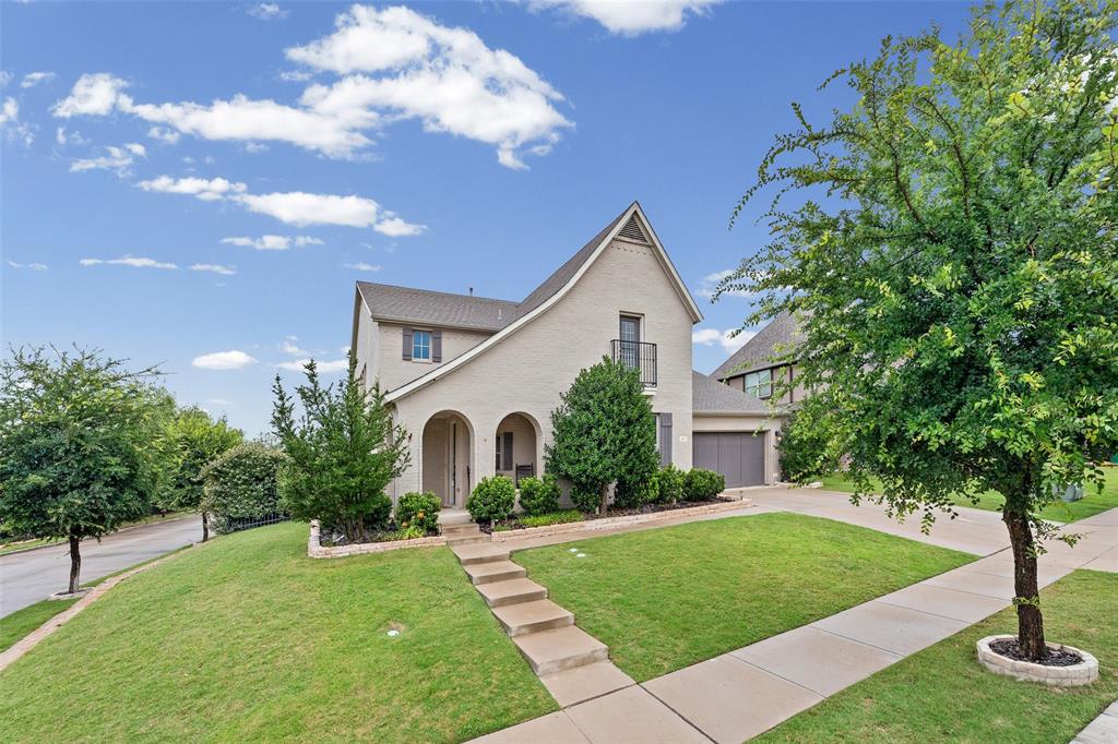 437 Prairie Run Aledo, TX 76008 - Photo 2 of 33 Two-story residence featuring light-colored brick exterior, a pitched roof, and an attached two-car garage