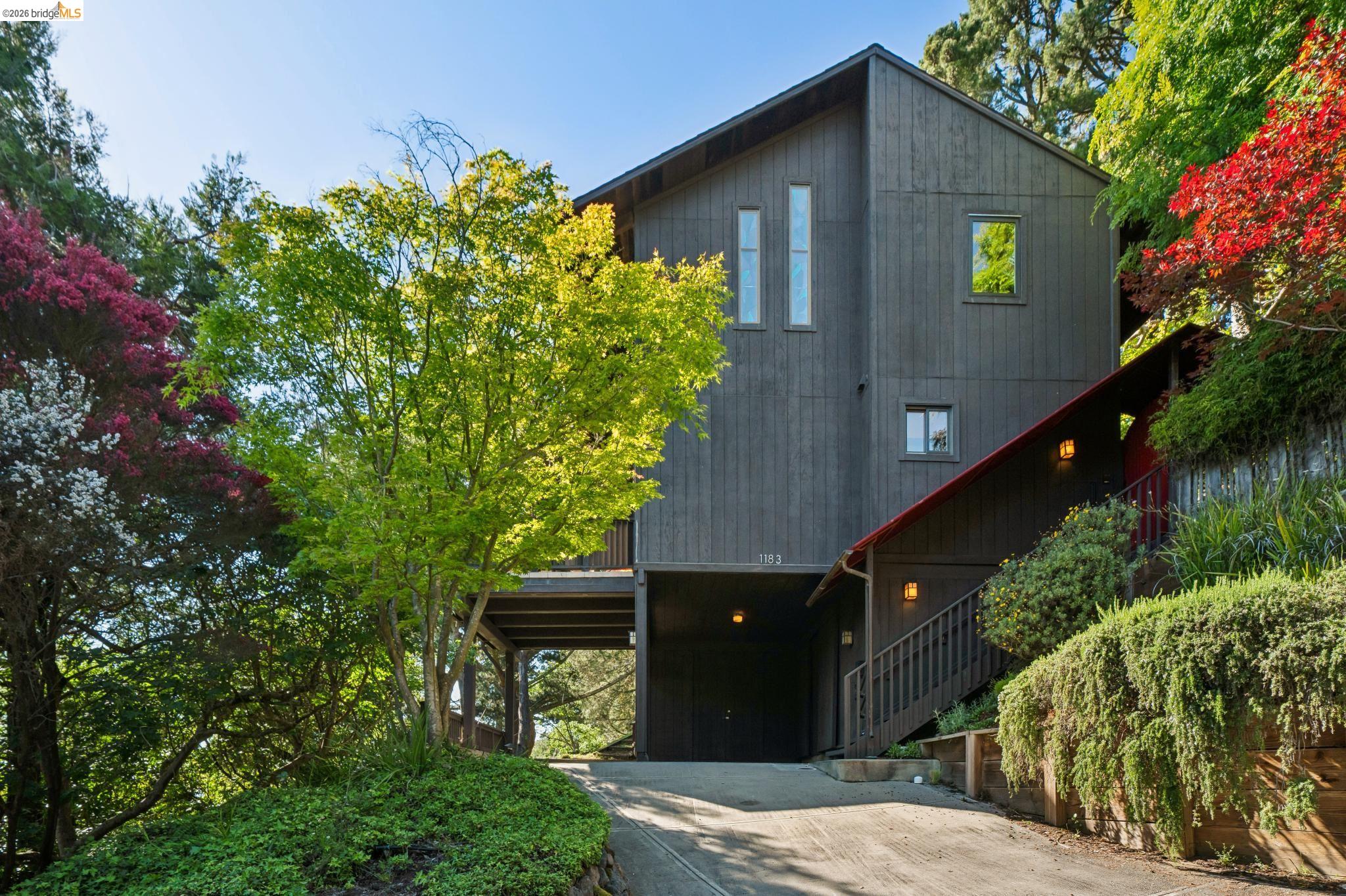 1183 Keeler Avenue Berkeley, CA 94708 - Photo 1 of 53 View of front of home featuring concrete driveway and a carport
