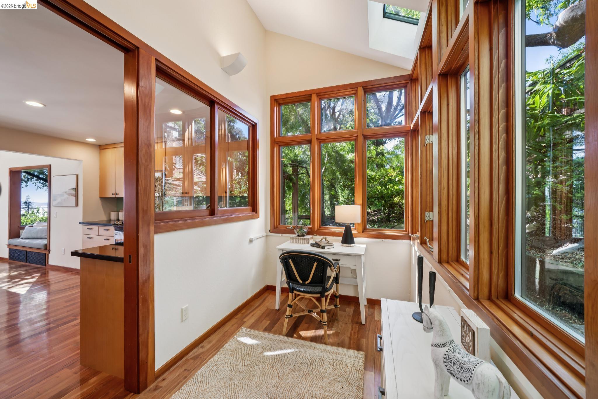 1183 Keeler Avenue Berkeley, CA 94708 - Photo 27 of 53 Home office featuring dark wood-style flooring, built in desk, and vaulted ceiling